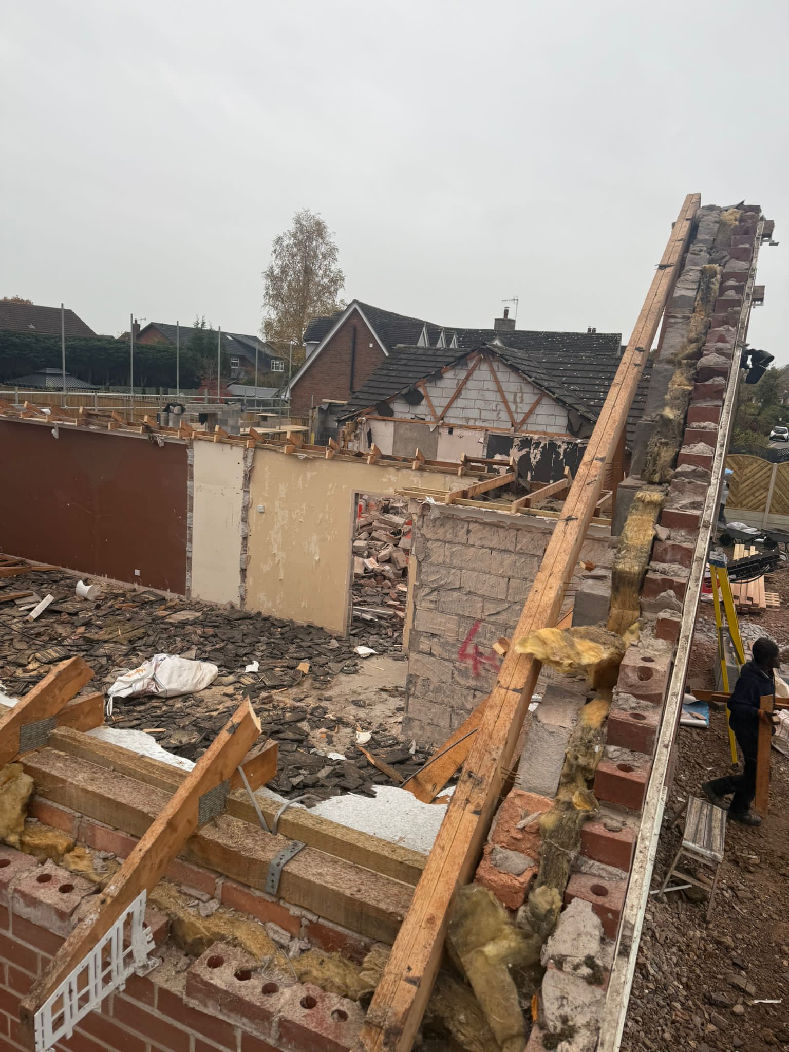 Roof stripped out with masonry and structure exposed during a major rebuild.